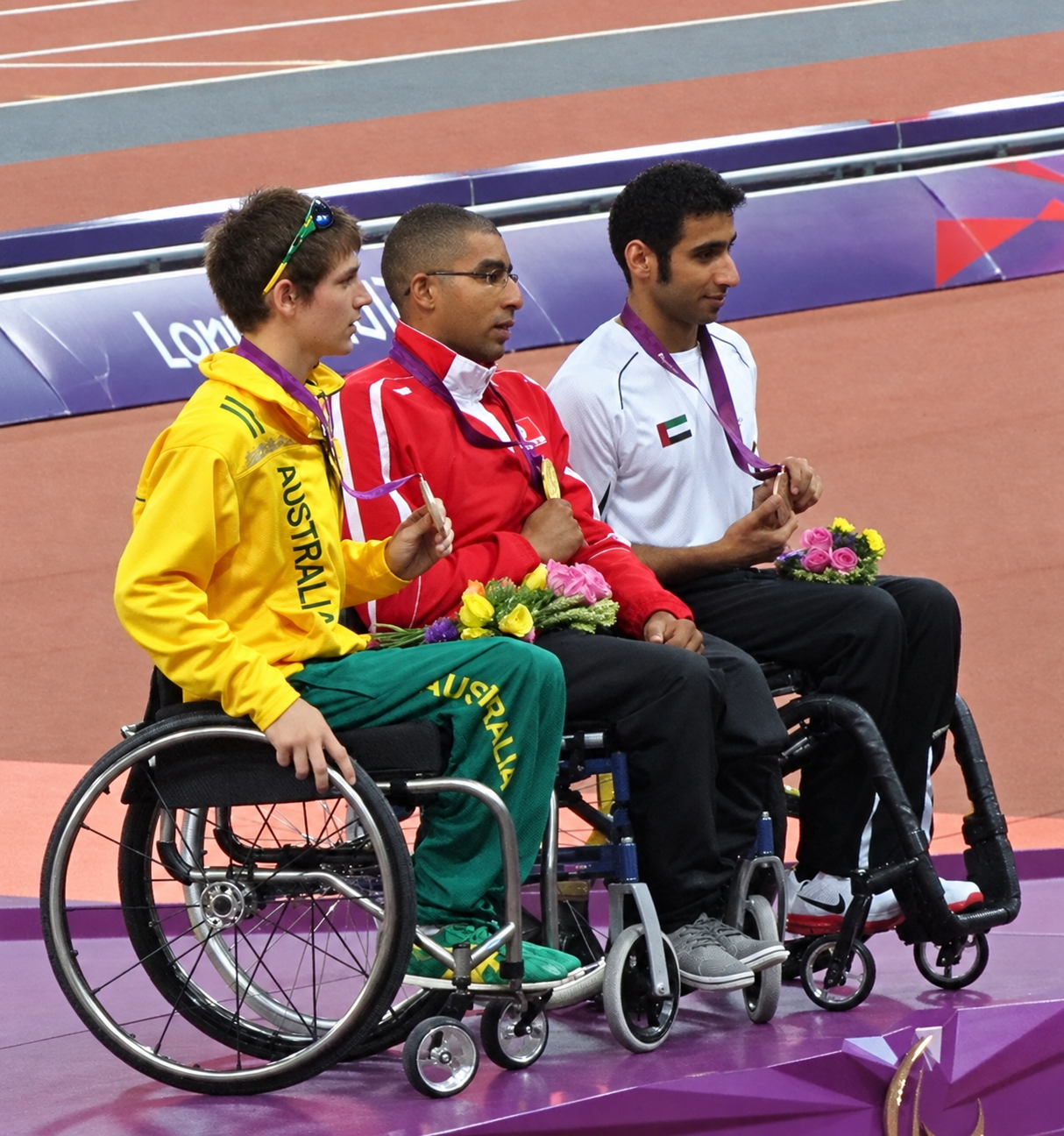 Walid Ktila (Tunisia), Rheed McCracken (Australia) and Mohamed Hammadi (United Arab Emirates) at the London 2012 men’s 100m T34 medal ceremony, 8 September 2012.