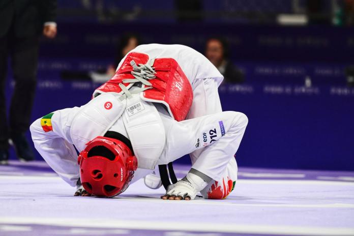 Keita kisses the competition mat