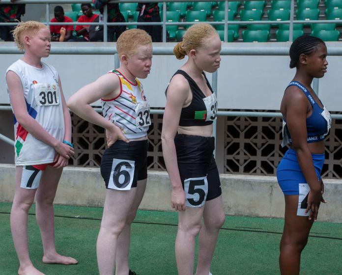 Kete and fellow runners wait to race.