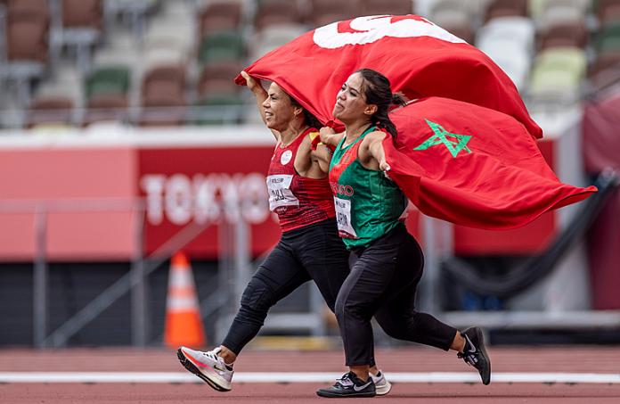Athletes celebrate with Tunisian and Moroccan flags