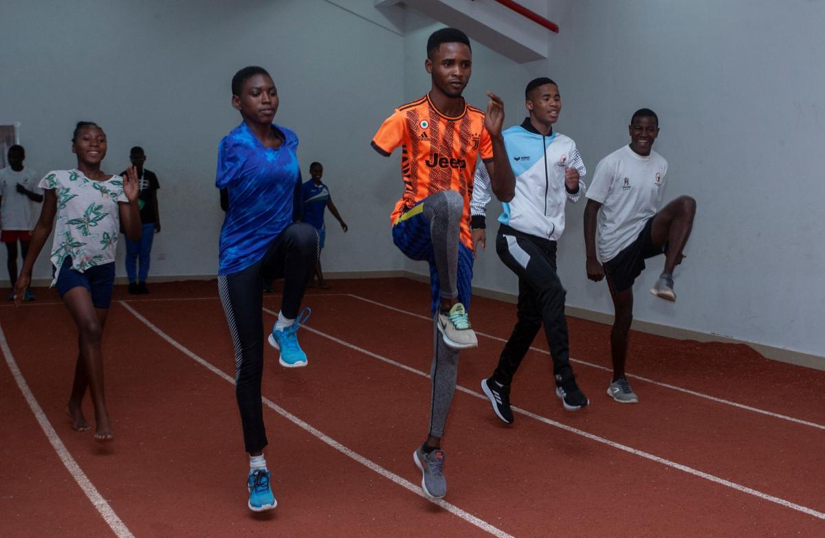 Amos Ahiagah joins athletes in a training session.