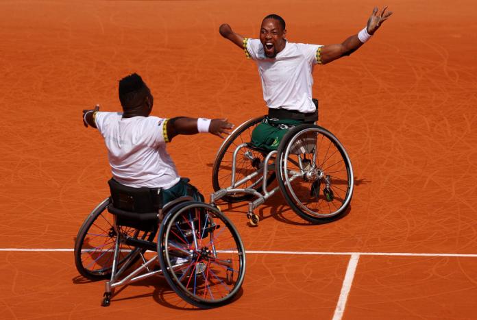 The South African pair celebrate on court