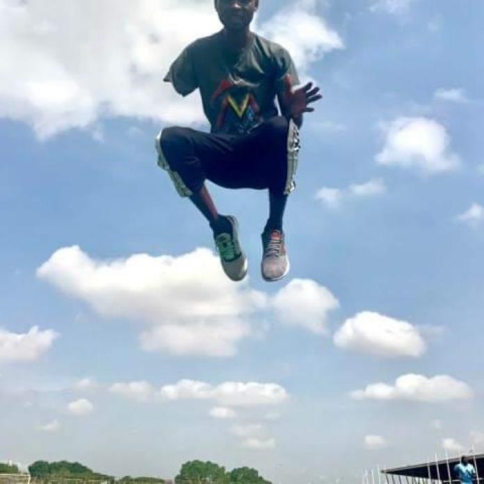 Ahiagah jumps for a photograph.