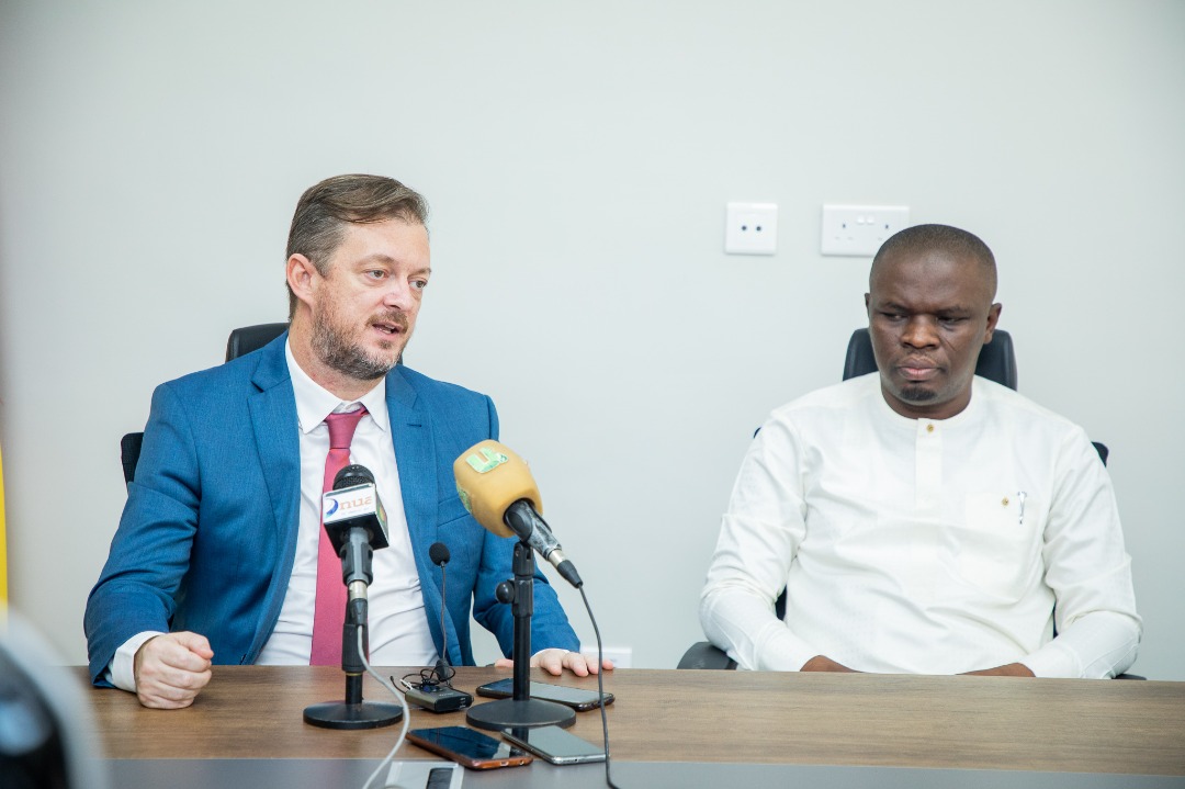 A closer view of Andrew Parsons speaking beside Mustapha Ussif at the media meeting.