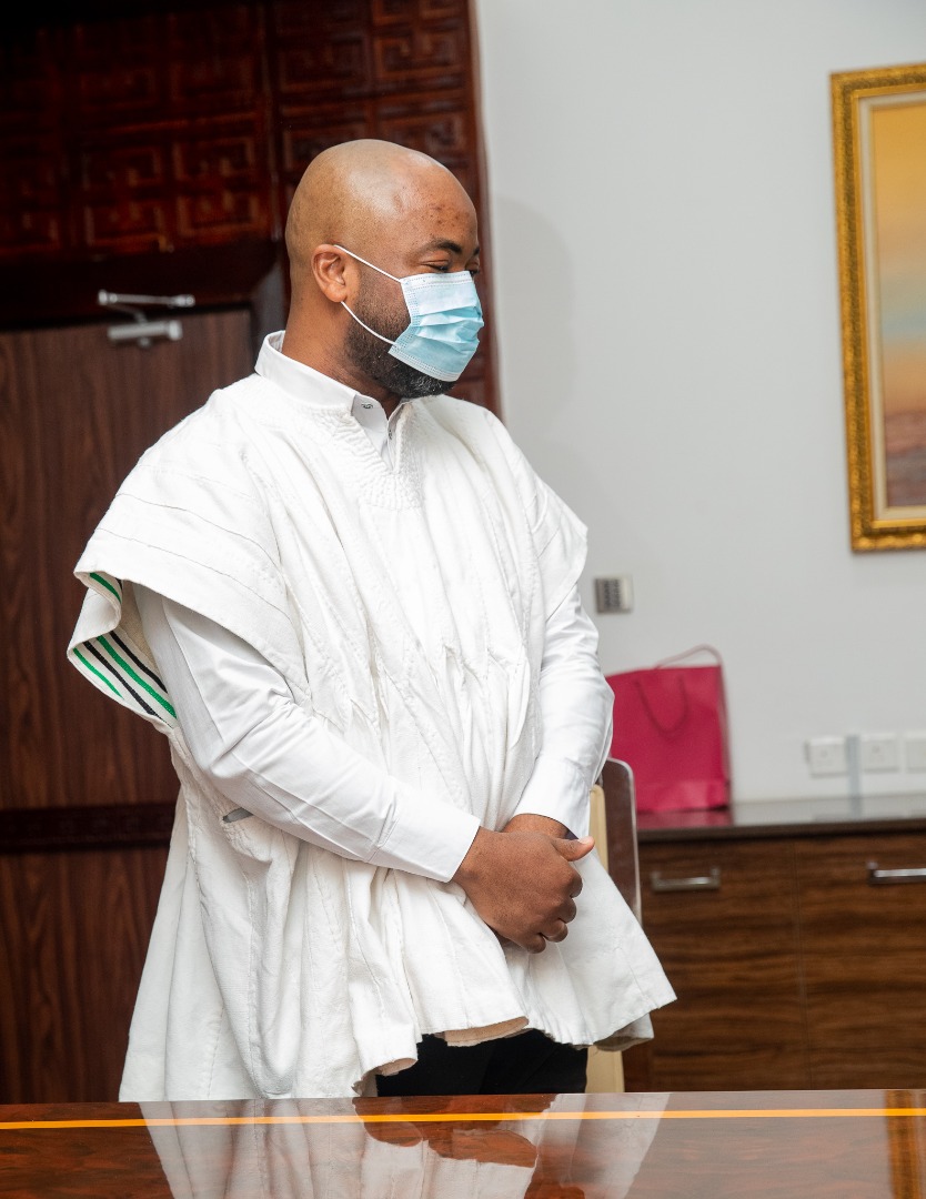 A delegation member stands beside the conference table at Jubilee House.