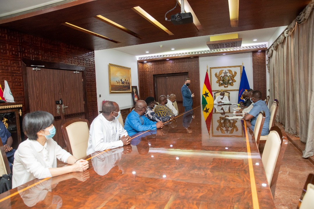 Participants seated around the long conference table for discussions at Jubilee House.