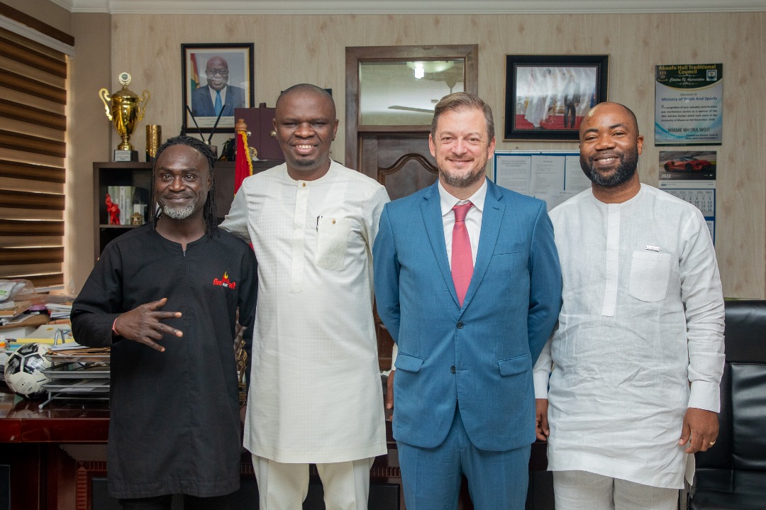 Andrew Parsons, Mustapha Ussif, Samson Deen and a delegation member pose at the ministry.
